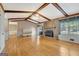 Spacious living room featuring a stone fireplace and wood beam ceiling at 110 Silver Leaf Dr, Fayetteville, GA 30214
