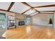 Bright living room with hardwood floors, stone fireplace, beamed ceilings, and lots of natural light at 110 Silver Leaf Dr, Fayetteville, GA 30214