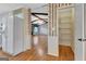 View of the living room and pantry with hardwood floors and a vaulted ceiling featuring exposed beams at 110 Silver Leaf Dr, Fayetteville, GA 30214