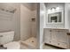 Bathroom features white tiling in the shower and a marble vanity at 19 Mcdonough St, Hampton, GA 30228