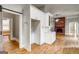 Living room boasting hardwood floors and a brick fireplace, creating a cozy atmosphere at 19 Mcdonough St, Hampton, GA 30228