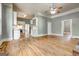 Open floor plan featuring hardwood floors and a view into the kitchen at 19 Mcdonough St, Hampton, GA 30228