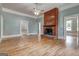 Living room with brick fireplace and hardwood floors at 19 Mcdonough St, Hampton, GA 30228