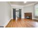 Living room with hardwood floors and a brick fireplace at 19 Mcdonough St, Hampton, GA 30228