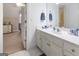 Bathroom featuring a white countertop and cabinets with an attached bedroom at 8040 Classic Dr, Jonesboro, GA 30236