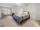 Neutral bedroom features a light-filled window, carpeted floor, and calming color palette at 8040 Classic Dr, Jonesboro, GA 30236