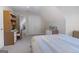 Neutral bedroom with light colored carpet with desk and dresser at 8040 Classic Dr, Jonesboro, GA 30236