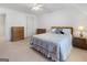 Cozy bedroom with a queen-sized bed, carpeted floors, and natural light, perfect for relaxation and comfort at 8040 Classic Dr, Jonesboro, GA 30236