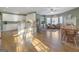 Dining area with hardwood floors, natural light, and views to adjoining sitting area at 8040 Classic Dr, Jonesboro, GA 30236