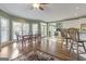 Sunlit dining area with a classic table set and hardwood floors at 8040 Classic Dr, Jonesboro, GA 30236