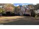 Charming two-story brick home with mature trees and a well-manicured lawn at 8040 Classic Dr, Jonesboro, GA 30236
