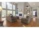 Bright living room with hardwood floors, fireplace, built-in shelving, and large windows at 8040 Classic Dr, Jonesboro, GA 30236