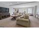 Spacious living room featuring comfortable seating and large windows for natural light at 8040 Classic Dr, Jonesboro, GA 30236