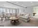 Cozy living room featuring plush sofas, a round coffee table, and natural light at 8040 Classic Dr, Jonesboro, GA 30236