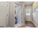Functional mudroom with access to laundry room and backyard, featuring hardwood floors and ample natural light at 8040 Classic Dr, Jonesboro, GA 30236