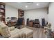 Home office space with a wooden desk, chair, and ample storage options at 8040 Classic Dr, Jonesboro, GA 30236
