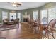 Cozy sitting area with a fireplace, hardwood floors, and comfortable seating at 8040 Classic Dr, Jonesboro, GA 30236