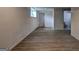 Unfinished basement featuring neutral paint, wood-look floors, recessed lighting, and an open bathroom at 6454 Boca Grande Blvd, Forest Park, GA 30297