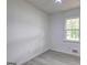 Bedroom features wood-look flooring, a ceiling fan, and one window at 6454 Boca Grande Blvd, Forest Park, GA 30297