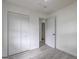 Bedroom showing wood-look floors and closet at 6454 Boca Grande Blvd, Forest Park, GA 30297