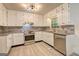 Bright kitchen featuring stainless steel appliances, granite countertops, and ample cabinet space at 6454 Boca Grande Blvd, Forest Park, GA 30297