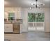 Bright kitchen featuring stainless steel appliances, granite countertops, and sliding glass doors at 6454 Boca Grande Blvd, Forest Park, GA 30297