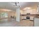 Open-concept living room featuring hardwood floors, modern lighting, and ample natural light at 6454 Boca Grande Blvd, Forest Park, GA 30297