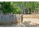 This backyard features a wooden fence surrounding the property, providing privacy and security at 1310 Yarborough Dr, Peachtree City, GA 30269