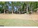 Backyard with retaining wall and playground, perfect for and provides added privacy and seclusion at 1310 Yarborough Dr, Peachtree City, GA 30269
