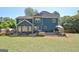 Expansive backyard featuring a patio with dining and lounge areas, perfect for outdoor entertaining and Gathering gatherings at 1310 Yarborough Dr, Peachtree City, GA 30269