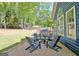 Backyard stone firepit with lounge chairs, offering a cozy space for relaxing and enjoying outdoor evenings at 1310 Yarborough Dr, Peachtree City, GA 30269