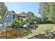 Expansive backyard featuring a patio with dining and lounge areas, perfect for outdoor entertaining and Gathering gatherings at 1310 Yarborough Dr, Peachtree City, GA 30269