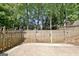 This backyard features a wooden fence surrounding the property, providing privacy and security at 1310 Yarborough Dr, Peachtree City, GA 30269