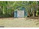 This backyard features a storage shed and a wooden fence surrounding the property at 1310 Yarborough Dr, Peachtree City, GA 30269