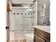 Bathroom features a shower-tub combo with glass door, single sink and vanity at 1310 Yarborough Dr, Peachtree City, GA 30269