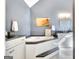 Modern bathroom features a soaking tub, granite countertops, and grey walls at 1310 Yarborough Dr, Peachtree City, GA 30269