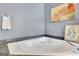 Bathroom features soaking tub with a granite surround and grey walls at 1310 Yarborough Dr, Peachtree City, GA 30269
