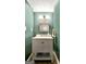 Charming half-bathroom featuring a marble countertop and modern fixtures at 1310 Yarborough Dr, Peachtree City, GA 30269