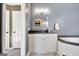 Bathroom with a soaking tub, granite countertops, and grey walls at 1310 Yarborough Dr, Peachtree City, GA 30269