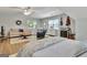 Open bedroom area showcases a comfortable sofa, desk, and musical instruments, blending relaxation with creative pursuits at 1310 Yarborough Dr, Peachtree City, GA 30269