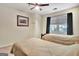 Bedroom featuring two twin beds, ceiling fan, and large window at 1310 Yarborough Dr, Peachtree City, GA 30269