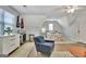 Inviting bedroom space featuring a bed, seating area, and ample natural light, creating a cozy and versatile retreat at 1310 Yarborough Dr, Peachtree City, GA 30269