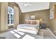 Cozy bedroom with vaulted ceiling, neutral carpet, and a large window at 1310 Yarborough Dr, Peachtree City, GA 30269