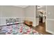 Bonus room showing colorful rug and hardwood floors at 1310 Yarborough Dr, Peachtree City, GA 30269
