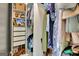 Open closet with shelves, drawers, shoe rack, and hanging clothing at 1310 Yarborough Dr, Peachtree City, GA 30269