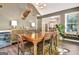 Elegant dining room with a wooden table, unique decor, and a nearby wine fridge at 1310 Yarborough Dr, Peachtree City, GA 30269
