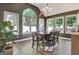 Open dining area with large windows providing natural light and rustic accents at 1310 Yarborough Dr, Peachtree City, GA 30269