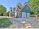 Spacious two-car garage and extended driveway complementing this well-maintained home at 1310 Yarborough Dr, Peachtree City, GA 30269