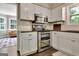 Clean, white kitchen showcases stainless steel appliances and modern cabinetry at 1310 Yarborough Dr, Peachtree City, GA 30269