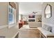 Bright living room view featuring a fireplace, large windows, and a comfortable seating area at 1310 Yarborough Dr, Peachtree City, GA 30269